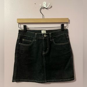 Dark Denim Calvin Klein Mini Skirt with Gold Contrast Stitching.
